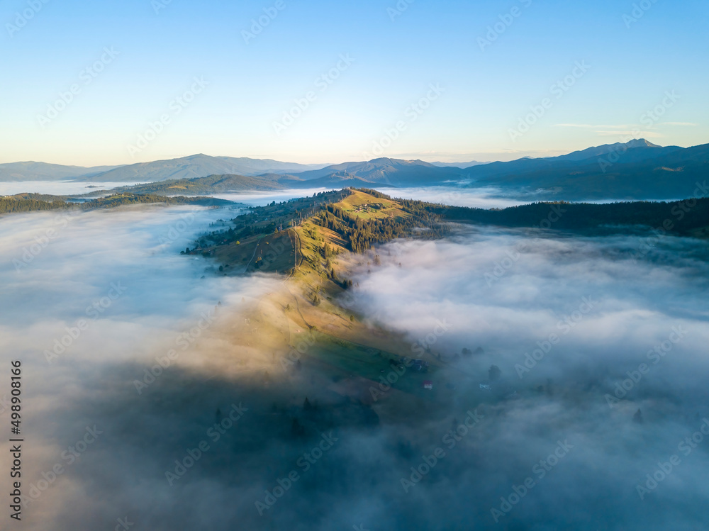 Morning fog in the Ukrainian Carpathians. Aerial drone view.