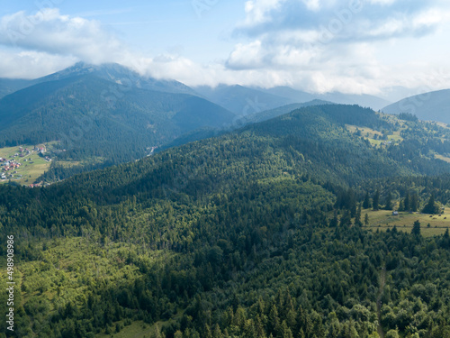 Green mountains of Ukrainian Carpathians in summer. Sunny day. Aerial drone view.