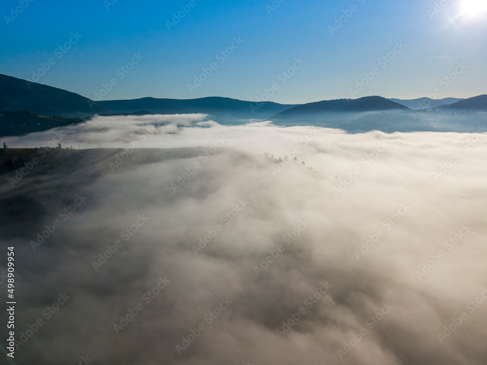 Morning fog in the Ukrainian Carpathians. Aerial drone view. Morning fog in the Ukrainian Carpathians. Aerial drone view.