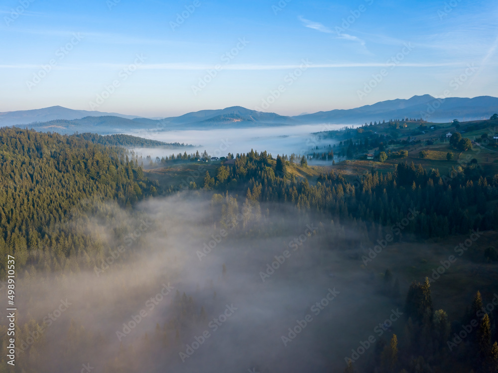Morning mist in Ukrainian Carpathian mountains. Aerial drone view. Morning mist in Ukrainian Carpathian mountains. Aerial drone view.