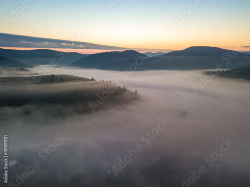 Morning fog in the Ukrainian Carpathians. Aerial drone view.