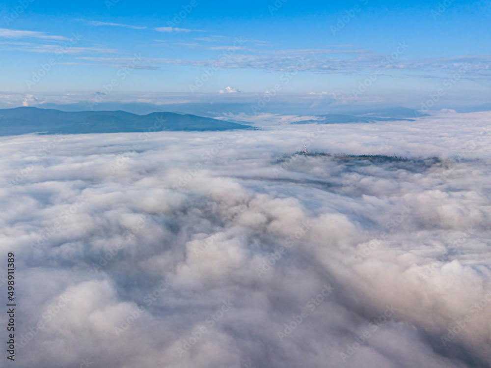 High flight above the clouds in the mountains. Aerial drone view. High flight above the clouds in the mountains. Aerial drone view.