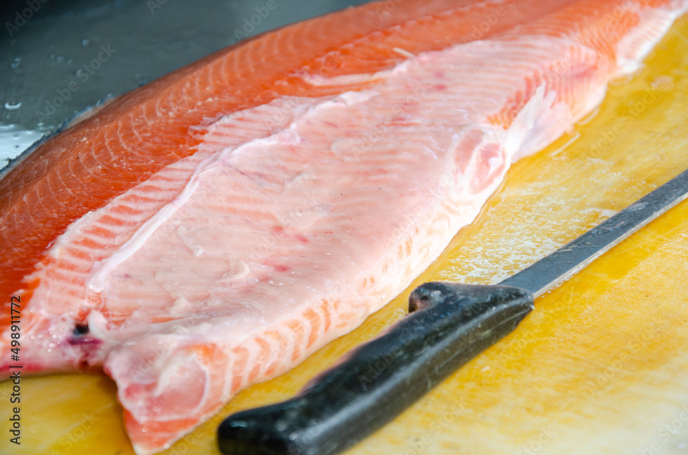 Red salmon fish. salmon fillet on the table. Healthy eating red salmon fish. Photo on fish production.