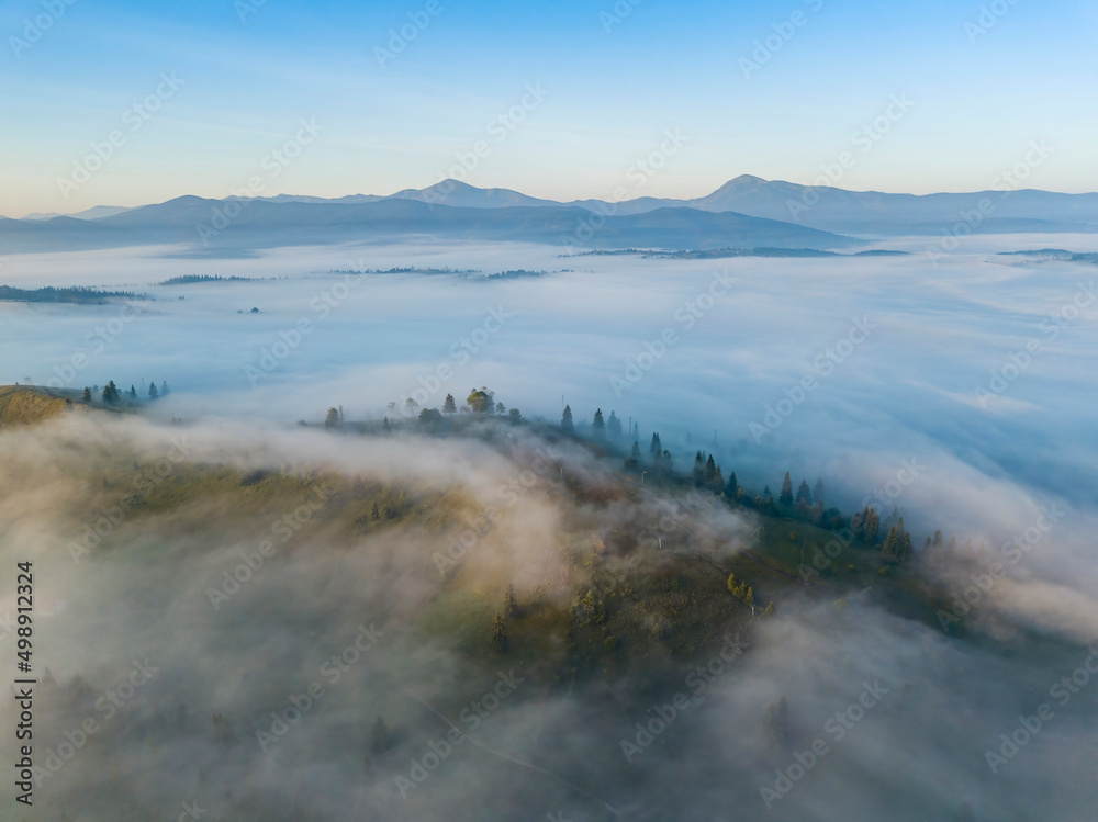 Morning mist in Ukrainian Carpathian mountains. Aerial drone view. Morning mist in Ukrainian Carpathian mountains. Aerial drone view.