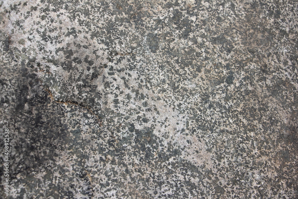 Dark old worn stone surface. Gray stone texture background. Dark old worn stone surface. Gray stone texture background.