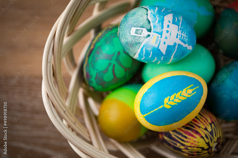 Easter egg painted by Ukrainian national colors, blue and yellow, and ...