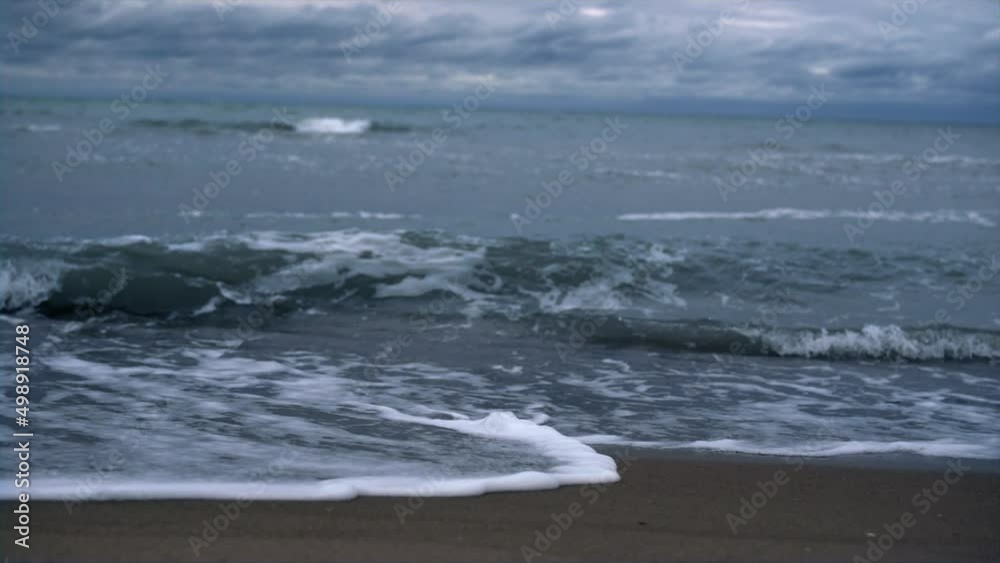 Sea waves crash beach on dark stormy weather ocean coast landscape background. Sea waves crash beach on dark stormy weather ocean coast landscape background.