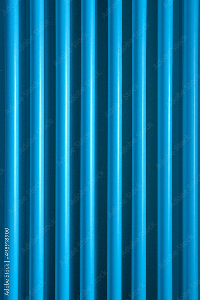 Stripes of blue light cut through the darkness creating an ideal background for textures and patterns. Stripes of blue light cut through the darkness creating an ideal background for textures and patterns.