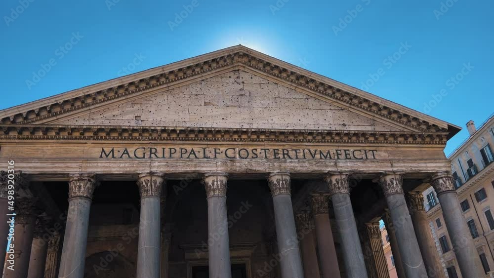 Panning shot of The Pantheon Building against blue sky in summer in Rome,Italy Panning shot of The Pantheon Building against blue sky in summer in Rome,Italy