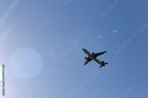 Fototapeta Naklejka Na Ścianę i Meble -  Passenger plane in the blue sky - Air travel
