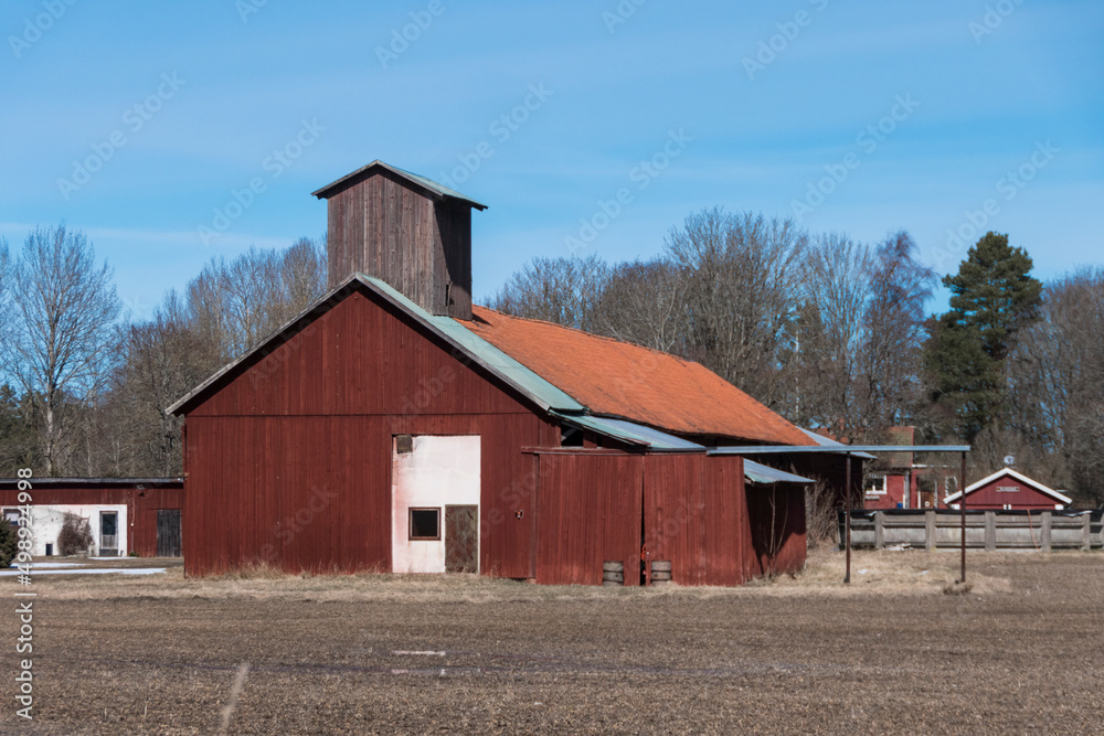 Tortuna, Sweden A red barn in a winter landscape. Tortuna, Sweden A red barn in a winter landscape.