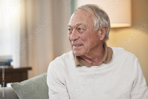 Hes enjoying the retired life. Shot of an elderly man sitting on the couch at home.