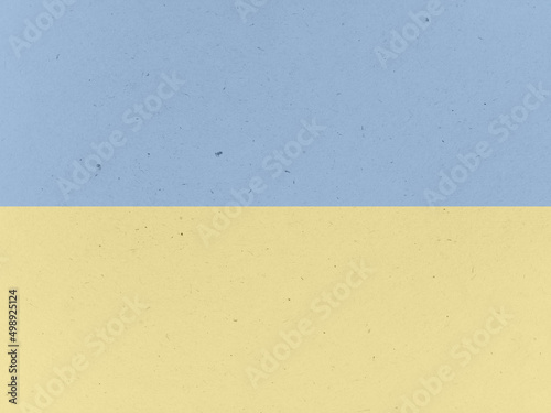 Old paper with spotted texture background. Blue and yellow colors.