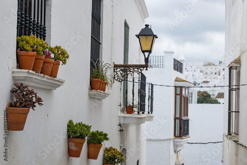 Local streets of the white Spanish Andalusian town of Vejer de la Frontera in a cloudy winter day