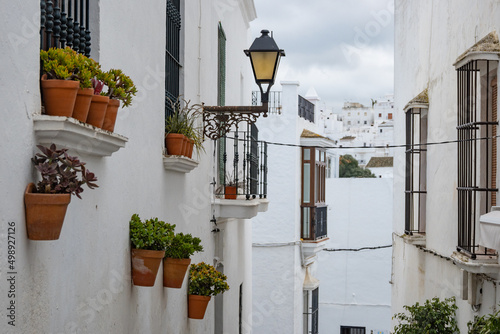 Local streets of the white Spanish Andalusian town of Vejer de la Frontera in a cloudy winter day