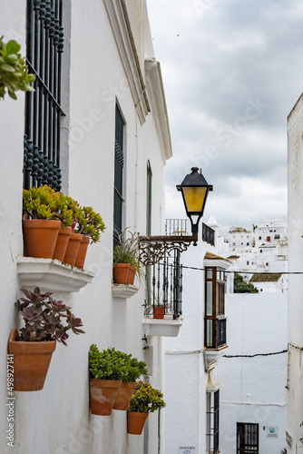 Local streets of the white Spanish Andalusian town of Vejer de la Frontera in a cloudy winter day