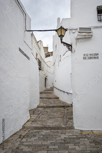 Local streets of the white Spanish Andalusian town of Vejer de la Frontera in a cloudy winter day