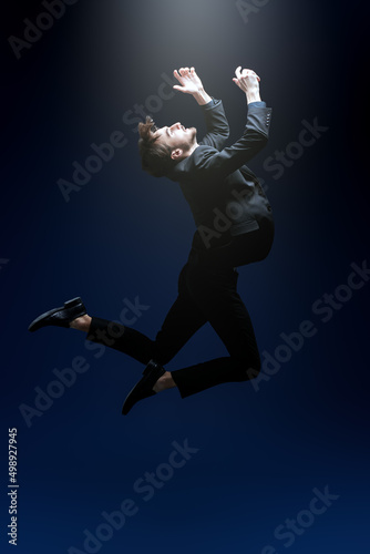 man in suit flying up © Andrey Kiselev