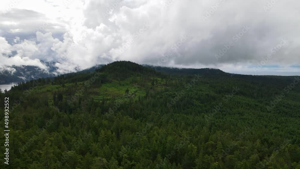 Panoramic view over the lush green forests and mountains along the Sunshine Coast Trail in British Columbia, Canada. Wide angle aerial shot Panoramic view over the lush green forests and mountains along the Sunshine Coast Trail in British Columbia, Canada. Wide angle aerial shot