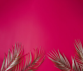 A hot pink background with gilded gold accent palm leaves for an elegant look