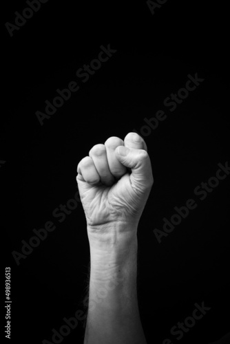 Hand demonstrating the Ukrainian sign language letter 'A'.