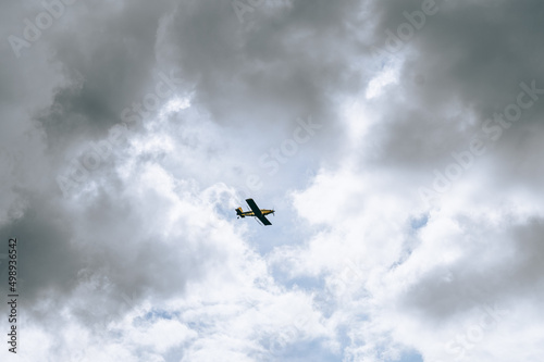 airplane in the clouded sky