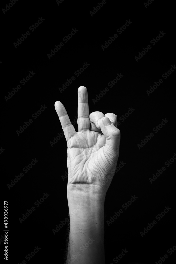 Hand demonstrating the Ukrainian sign language letter 'И'. Hand demonstrating the Ukrainian sign language letter 'И'.