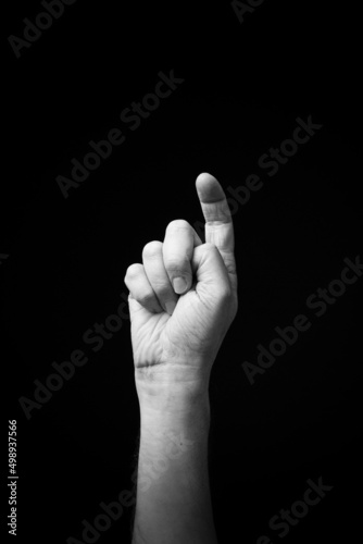 Hand demonstrating the Ukrainian sign language letter 'Х'.