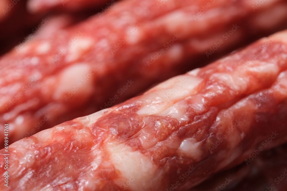 extreme close up of Chinese sausage (Lap cheong). Traditional dried, hard and seasoned sausage in China. Macro of food extreme close up of Chinese sausage (Lap cheong). Traditional dried, hard and seasoned sausage in China. Macro of food