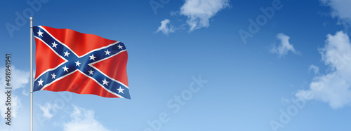 Tableau sur toile Confederate flag isolated on a blue sky. Horizontal banner