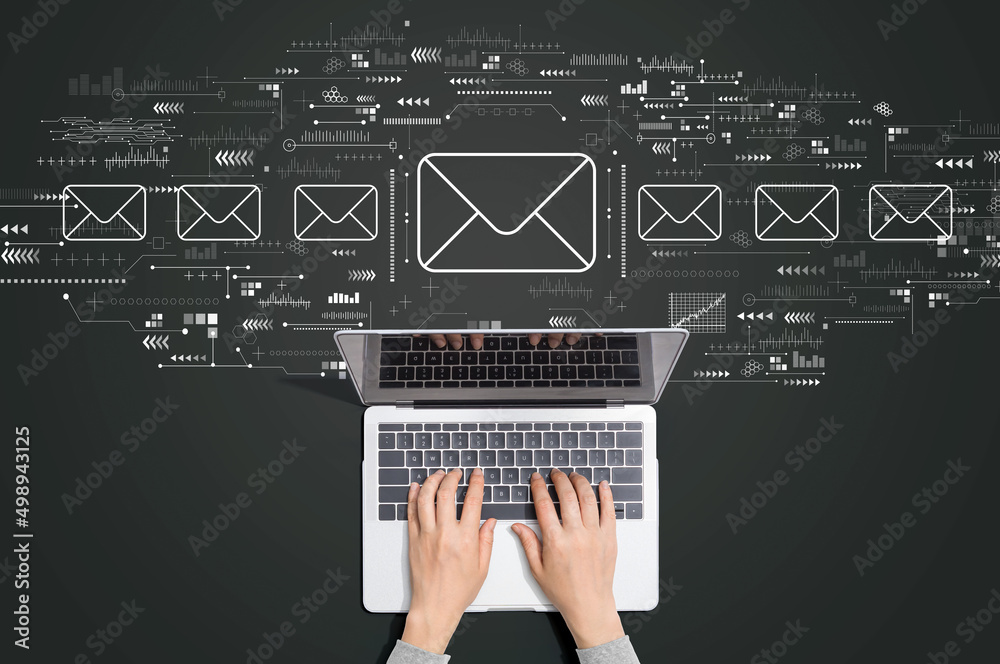 Email concept with person using a laptop computer - obrazy, fototapety, plakaty 