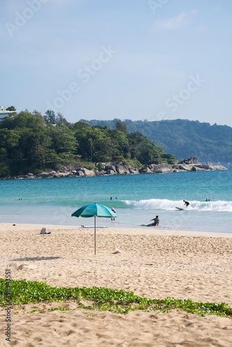 Landscape clean sea Umbrella on beach mountain background.