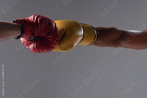 practice boxing,two hand wearing boxing gloves hit together. © montira