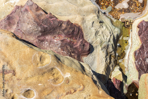 closeup of beautiful detail of beach rocks with melted texture and color variation
