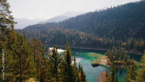 lake cauma in switzerland in autumn with pines and larches photo