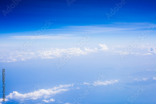 Top view from fly, aerial view of clouds in blue sky © CK