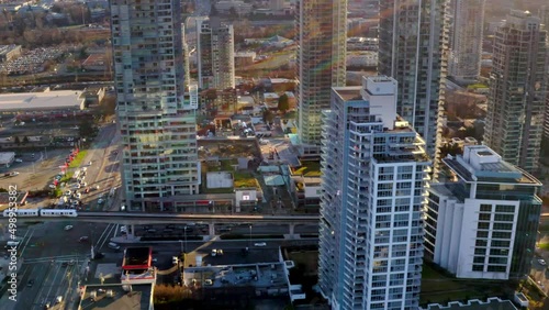 High-rise Office And Hotels Near Brentwood Town Centre Skytrain Station In Burnaby, BC, Canada. - aerial panning photo