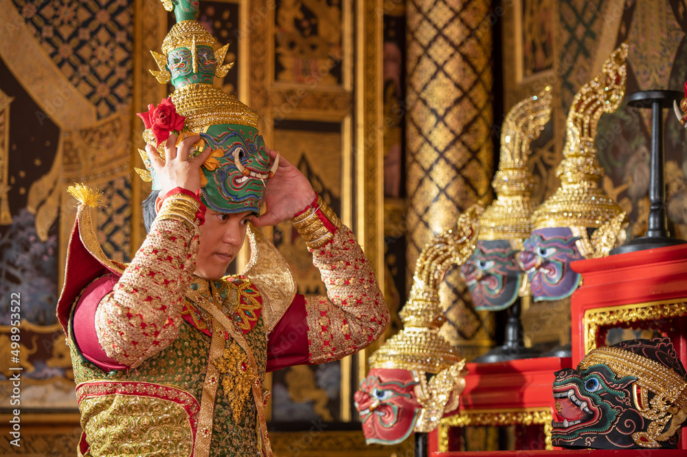 Pantomime (Khon) is traditional Thai classic masked play enacting scenes from the Ramayana with a backdrop of Thai paintings in a public place at Wat Phra Khao, Ayutthaya province, Thailand Pantomime (Khon) is traditional Thai classic masked play enacting scenes from the Ramayana with a backdrop of Thai paintings in a public place at Wat Phra Khao, Ayutthaya province, Thailand
