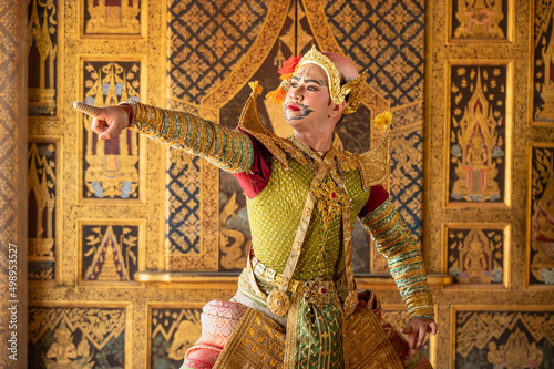 Pantomime (Khon) is traditional Thai classic masked play enacting scenes from the Ramayana with a backdrop of Thai paintings in a public place at Wat Phra Khao, Ayutthaya province, Thailand