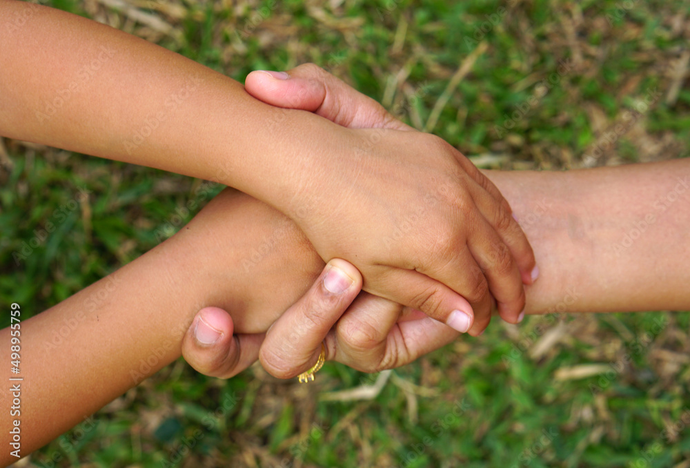 Mother and Child’s holding hands to receive something Mother and Child’s holding hands to receive something