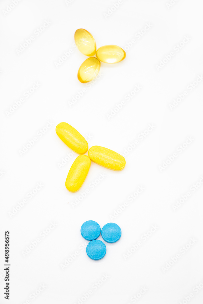 Different pills isolate on white background , selective focus, top view