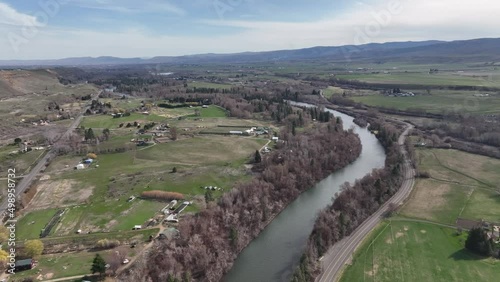 Cinematic 4K aerial drone flyover shot of the Yakima River in Western Washington state near Ellensburg, Kittitas County near the foothills photo