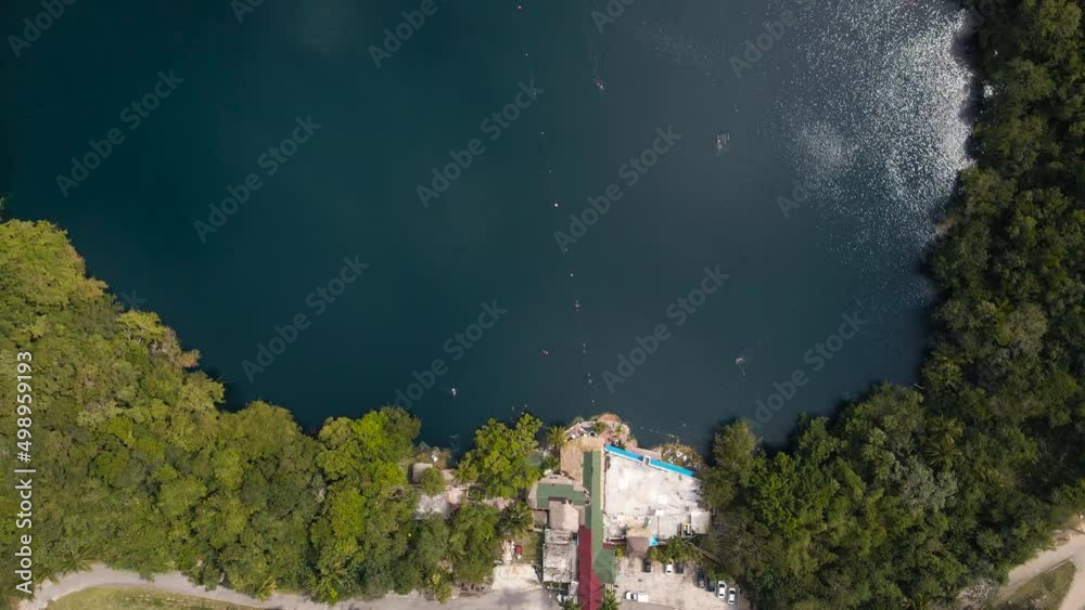 Bird's eye view top down drone shot of the famous Cenote Azul located ...