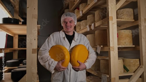 Portrait Of Cheesemaker In Cellar, Basement. Home Cheese Production, Business photo