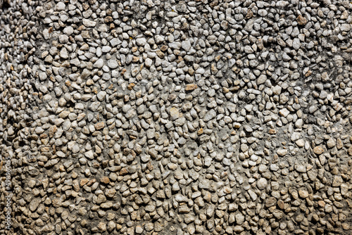 Small rocks construction background. Crushed stones texture of buildings and roads for landscaping top view. High quality photo