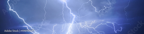 Fork lightning striking down during summer storm 