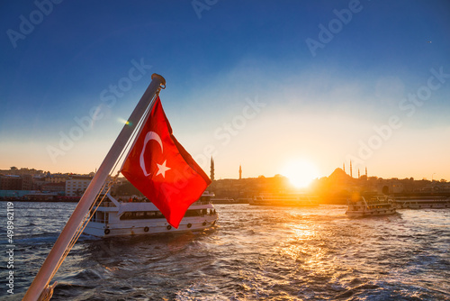 Fotografie Waving Turkish flag against Istanbul Turkey