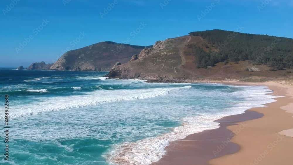 Beautiful aerial view of popular scenic spot on Way of St. James trail. Sandy beach and clear sea at Fisterra, Spain Beautiful aerial view of popular scenic spot on Way of St. James trail. Sandy beach and clear sea at Fisterra, Spain