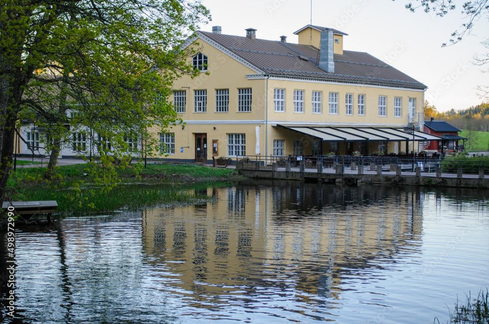 Beautiful building with reflection from a river from Fiskars Finland Beautiful building with reflection from a river from Fiskars Finland