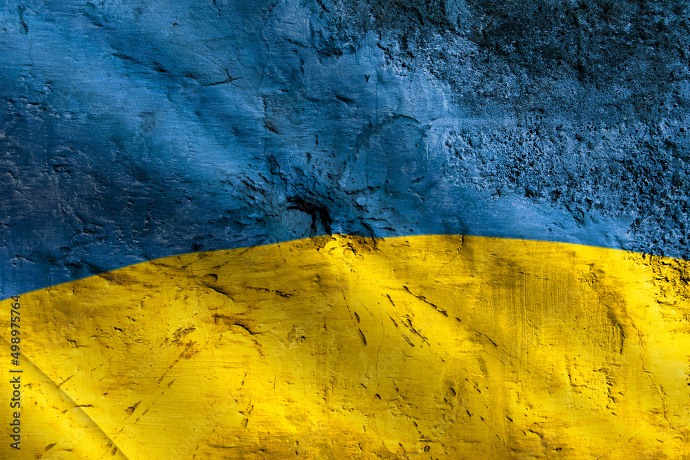 Ukrainian flag on a broken cracked wall.